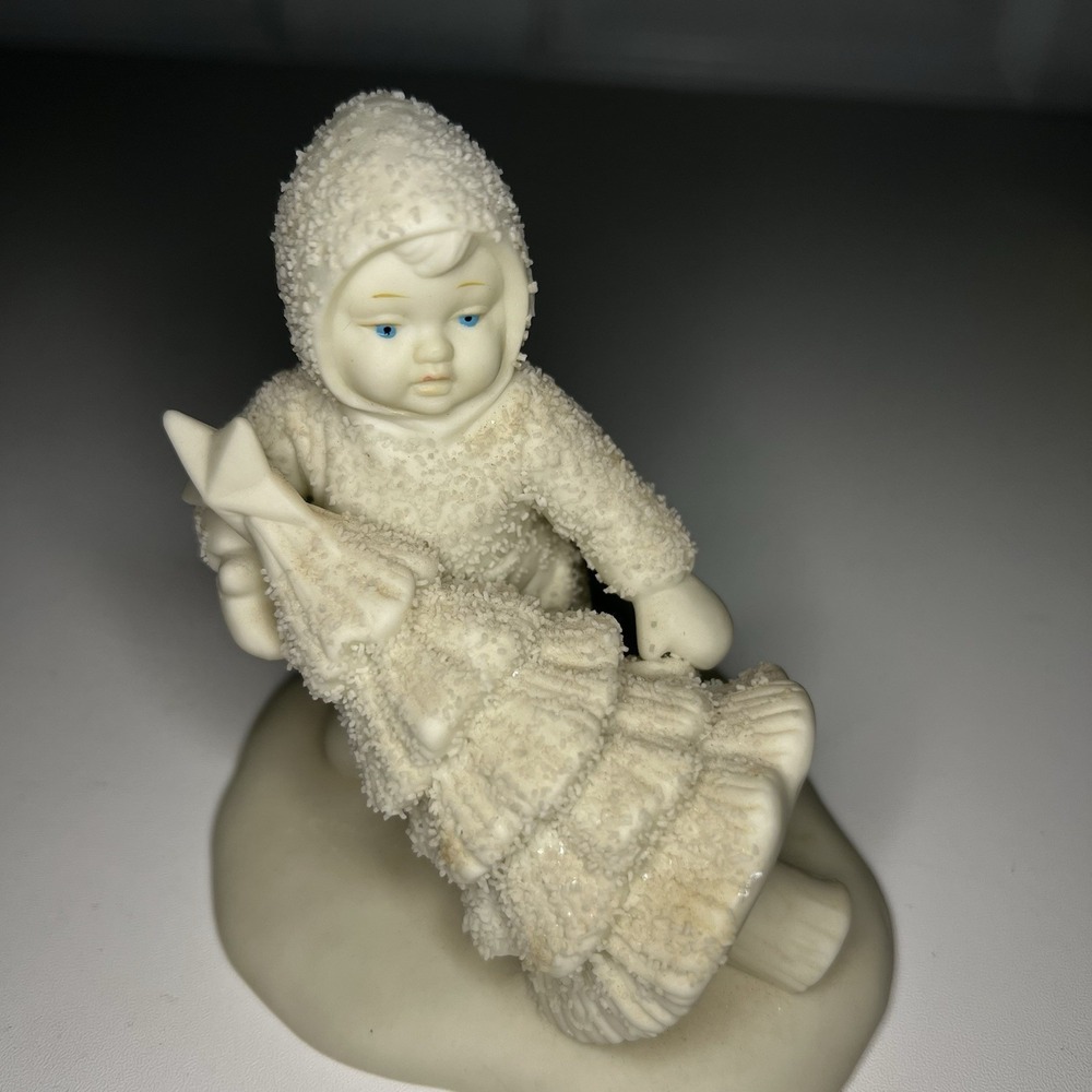Department 56 Snowbabies piece titled "I'll Put Up The Tree"